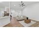 Bright open living room features new flooring, neutral paint, and ceiling fan at 290 Magnolia Walk Ln, Atlanta, GA 30349