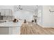 Open concept living space with a fireplace, kitchen bar, and natural light at 290 Magnolia Walk Ln, Atlanta, GA 30349