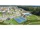 Aerial view of community with a pool, tennis courts, walking trails, clubhouse, pond, and other amenities at 315 Silver Moon Dr, Loganville, GA 30052