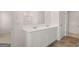 Bright bathroom features a double vanity with white cabinets and tile-look flooring at 315 Silver Moon Dr, Loganville, GA 30052
