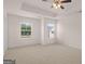 This bedroom is complete with a ceiling fan and carpeted floors at 315 Silver Moon Dr, Loganville, GA 30052