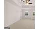 This expansive bedroom has plush carpeting and natural light from the windows at 315 Silver Moon Dr, Loganville, GA 30052