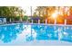 Stunning community pool featuring lounge area and sunlit cabanas at 315 Silver Moon Dr, Loganville, GA 30052
