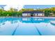 Community pool with swimming lanes and a pool house with chairs and umbrellas at 315 Silver Moon Dr, Loganville, GA 30052