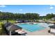 A beautiful aerial view of the community pool featuring cabanas, a grilling area and lots of lounging at 315 Silver Moon Dr, Loganville, GA 30052