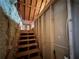 View of unfinished attic with stairs at 5668 Blanchard Pl, Sugar Hill, GA 30518