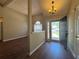 Bright entryway featuring hardwood floors, chandelier, and view of the front yard at 5668 Blanchard Pl, Sugar Hill, GA 30518