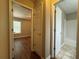 Hallway view to the bedroom and bathroom at 5668 Blanchard Pl, Sugar Hill, GA 30518