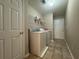 Tile floor laundry room with washer and dryer at 5668 Blanchard Pl, Sugar Hill, GA 30518