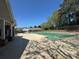 Community pool with a mushroom water feature and shaded seating area at 5668 Blanchard Pl, Sugar Hill, GA 30518