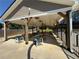 Covered pool pavilion with picnic tables and ceiling fans at 5668 Blanchard Pl, Sugar Hill, GA 30518