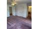 Bedroom featuring a ceiling fan, neutral-toned walls, and double closets at 9290 Prestwick Club Dr, Johns Creek, GA 30097