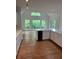 Modern kitchen with large windows, recessed lighting, and center island at 9290 Prestwick Club Dr, Johns Creek, GA 30097