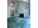 Living room with fireplace, built-in cabinets and vaulted ceilings with ceiling fan at 9290 Prestwick Club Dr, Johns Creek, GA 30097