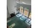 Open concept room with a fireplace, built-in shelves and a ceiling fan at 9290 Prestwick Club Dr, Johns Creek, GA 30097