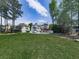 Expansive backyard with a pool, deck, and lush green lawn, offering a perfect outdoor retreat at 140 N Lakeside Nw Dr, Kennesaw, GA 30144