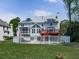 Beautiful backyard featuring a fenced pool, a spacious deck, and a well-maintained lawn for outdoor enjoyment at 140 N Lakeside Nw Dr, Kennesaw, GA 30144
