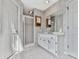 Bathroom featuring a white sink and vanity, and a glass shower enclosure at 140 N Lakeside Nw Dr, Kennesaw, GA 30144