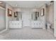 Large bathroom with double sinks, white cabinetry and large tile flooring at 140 N Lakeside Nw Dr, Kennesaw, GA 30144