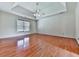 Spacious bedroom with tray ceilings, gleaming hardwood floors, and double window at 140 N Lakeside Nw Dr, Kennesaw, GA 30144