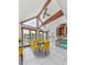 Bright dining area featuring large windows, water views, and stylish decor and ceiling beams at 140 N Lakeside Nw Dr, Kennesaw, GA 30144