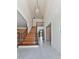 Grand foyer with high ceilings, chandelier, staircase with iron spindles, and tile flooring at 140 N Lakeside Nw Dr, Kennesaw, GA 30144