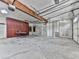 Spacious garage with ample storage, shelving, and overhead lighting at 140 N Lakeside Nw Dr, Kennesaw, GA 30144