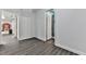 Hallway with wood-look floors leading to a bathroom and another room at 140 N Lakeside Nw Dr, Kennesaw, GA 30144