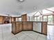 Open concept kitchen with an island, dishwasher, and views of the living room and sunroom at 140 N Lakeside Nw Dr, Kennesaw, GA 30144