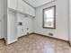 Laundry room with white cabinets and a window offering natural light at 140 N Lakeside Nw Dr, Kennesaw, GA 30144