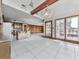 Open concept living area with tile floors and access to a spacious outdoor deck with hot tub at 140 N Lakeside Nw Dr, Kennesaw, GA 30144