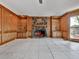 Spacious living room featuring a stone fireplace and custom built-in shelving and cabinetry at 140 N Lakeside Nw Dr, Kennesaw, GA 30144