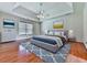 Spacious main bedroom features wood floors, a ceiling fan, and natural light from the window at 140 N Lakeside Nw Dr, Kennesaw, GA 30144