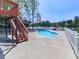 Backyard pool with a white fence and access to the lake at 140 N Lakeside Nw Dr, Kennesaw, GA 30144