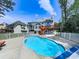 Backyard pool with a white fence and walk out deck at 140 N Lakeside Nw Dr, Kennesaw, GA 30144