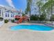 Inviting backyard pool and deck are perfect for entertaining and enjoying the outdoors at 140 N Lakeside Nw Dr, Kennesaw, GA 30144