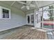 The spacious screened-in porch features wood flooring, a ceiling fan, and access to the interior at 140 N Lakeside Nw Dr, Kennesaw, GA 30144