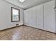 Room with large white wardrobes, window and unique, patterned flooring at 140 N Lakeside Nw Dr, Kennesaw, GA 30144