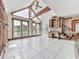 Bright sunroom with high ceilings, exposed beams, and large windows offering scenic lake views at 140 N Lakeside Nw Dr, Kennesaw, GA 30144