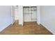 Bright bedroom features wood floors and a closet with wire shelving for organized storage at 1490 N Crossing Circle Ne Cir # 1490, Atlanta, GA 30329