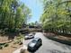 Apartment complex surrounded by lush trees, with parking available and well-kept grounds at 1490 N Crossing Circle Ne Cir # 1490, Atlanta, GA 30329