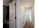 Hallway view featuring a bathroom, doors and hardwood flooring at 1490 N Crossing Circle Ne Cir # 1490, Atlanta, GA 30329