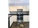 Kitchen featuring stainless steel appliances, tile backsplash, and light wood cabinetry at 1490 N Crossing Circle Ne Cir # 1490, Atlanta, GA 30329