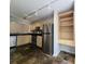 Kitchen featuring stainless steel appliances, tile backsplash, light wood cabinetry, and slate floors at 1490 N Crossing Circle Ne Cir # 1490, Atlanta, GA 30329