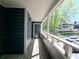 Charming covered patio features a view of the parking area and landscaped communal grounds at 1490 N Crossing Circle Ne Cir # 1490, Atlanta, GA 30329