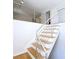 Modern staircase with stainless steel railing and light wood treads leads to upper level at 1490 N Crossing Circle Ne Cir # 1490, Atlanta, GA 30329