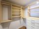 Organized walk-in closet with custom shelves, drawers, and ample storage for clothes and accessories at 1490 N Crossing Circle Ne Cir # 1490, Atlanta, GA 30329