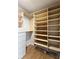 Well-organized walk-in closet featuring custom shelving, drawers, and ample space for storage at 1490 N Crossing Circle Ne Cir # 1490, Atlanta, GA 30329