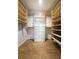 Bright walk-in closet with custom shelving and drawers for optimal organization at 1490 N Crossing Circle Ne Cir # 1490, Atlanta, GA 30329