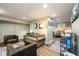 Finished basement featuring hardwood floors, ample seating, a book shelf, and recessed lighting at 2724 Parkwood Se Rd, Smyrna, GA 30080